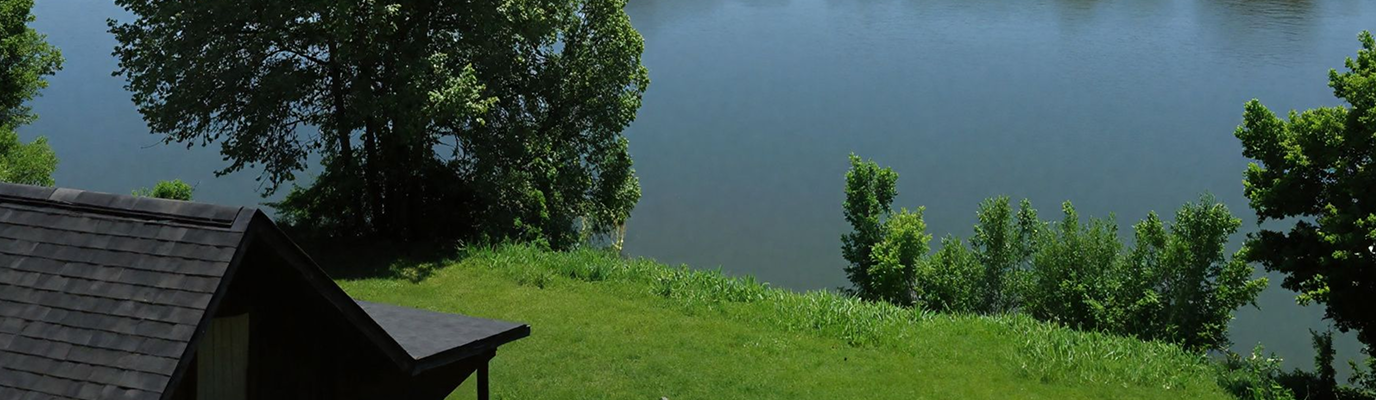Scenic view of cabin with lake